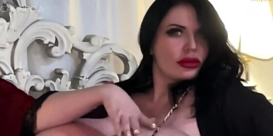 brunette seductress working her big boobs and hot ass